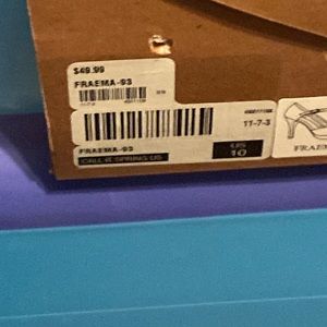 Black stiletto heels aerated on the side, like a screen type look